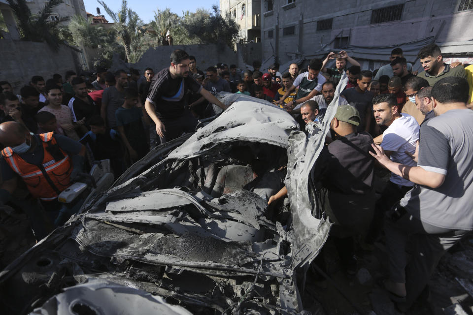 Palestinians look for survivors after an Israeli airstrike in Rafah, Gaza Strip, Thursday, Oct. 26, 2023. (AP Photo/Hatem Ali)