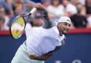 Nick Kyrgios of Australia serves to Daniil Medvedev during second round play at the National Bank Open tennis tournament Wednesday Aug. 10, 2022. in Montreal. (Paul Chiasson/The Canadian Press via AP)