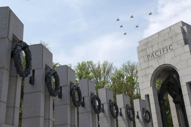 World War II era aircraft flies over the National World War II Memorial as part of the Arsenal of Democracy: World War II Victory Capitol Flyover in honor of the 70th anniversary of Victory in Europe Day, in Washington, D.C. on May 8, 2015. Fifteen waves of World War II era aircraft flew over the National Mall representing significant battles in celebration of the 70th anniversary of the Allies victory over the Nazi's. Photo by Kevin Dietsch/UPI