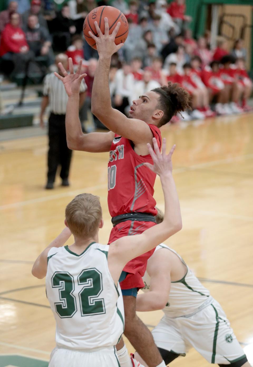 Canton South's Tavon Castle puts up a shot against Central Catholic earlier this season.