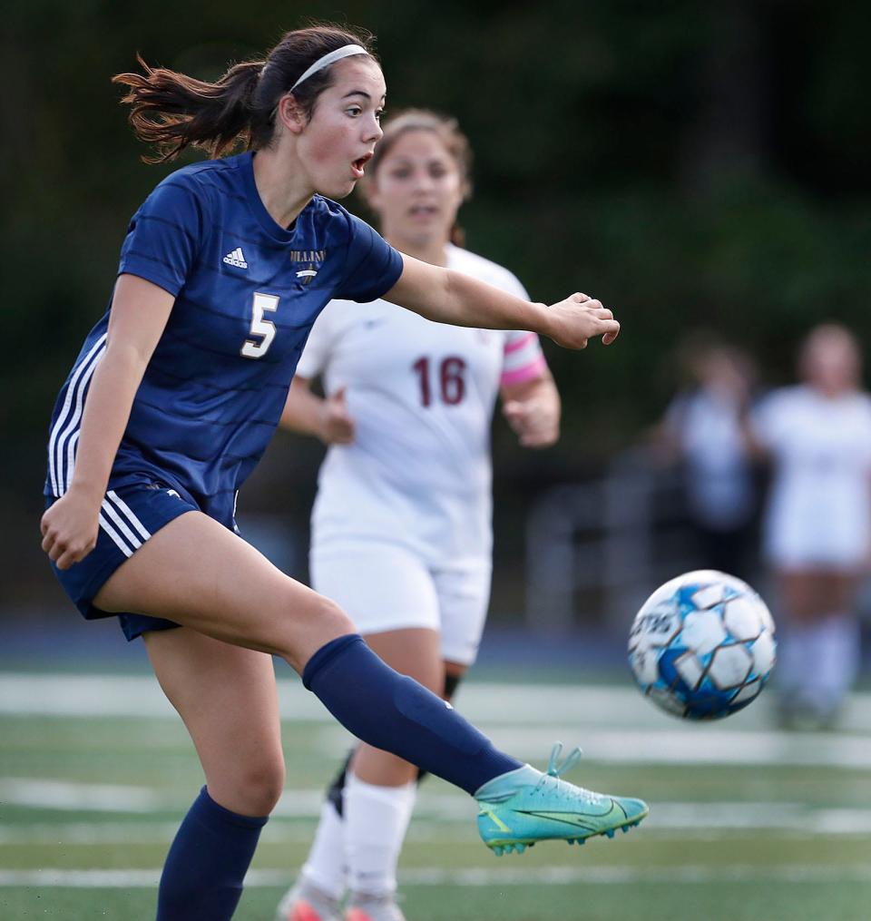 Archbishop Williams forward Maeve White takes a shot on the Bishop Stang net.