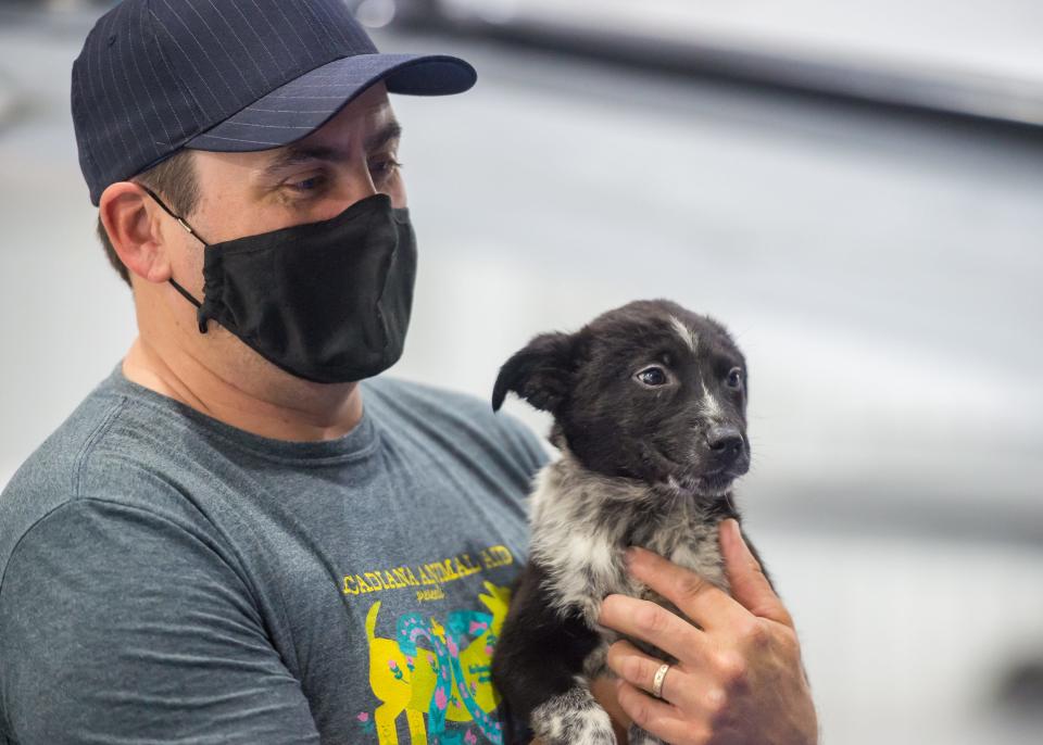 Abram Cross is one of the many volunteers helping to load animals into aircraft. Animals being flown out from Lafayette animal shelter to  NJ to help alleviate shelter pressure. Wednesday, March 17, 2021.