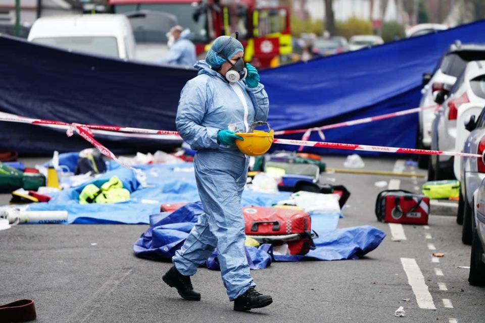 Forensic investigators at the scene in Collingwood Road, Sutton (Aaron Chown/PA) (PA Wire)
