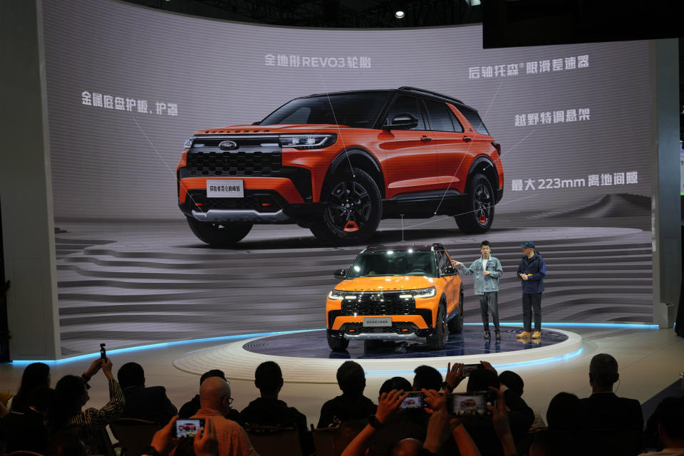 Ford presents its latest Explorer vehicle during the Auto Shanghai 2023 show in Shanghai, Tuesday, April 18, 2023. Global and Chinese automakers plan to unveil more than a dozen new electric SUVs, sedans and muscle cars this week at the Shanghai auto show, their first full-scale sales event in four years in a market that has become a workshop for developing electrics, self-driving cars and other technology. (AP Photo/Ng Han Guan)