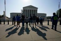 Visitors take photos at the U.S. Supreme Court in Washington