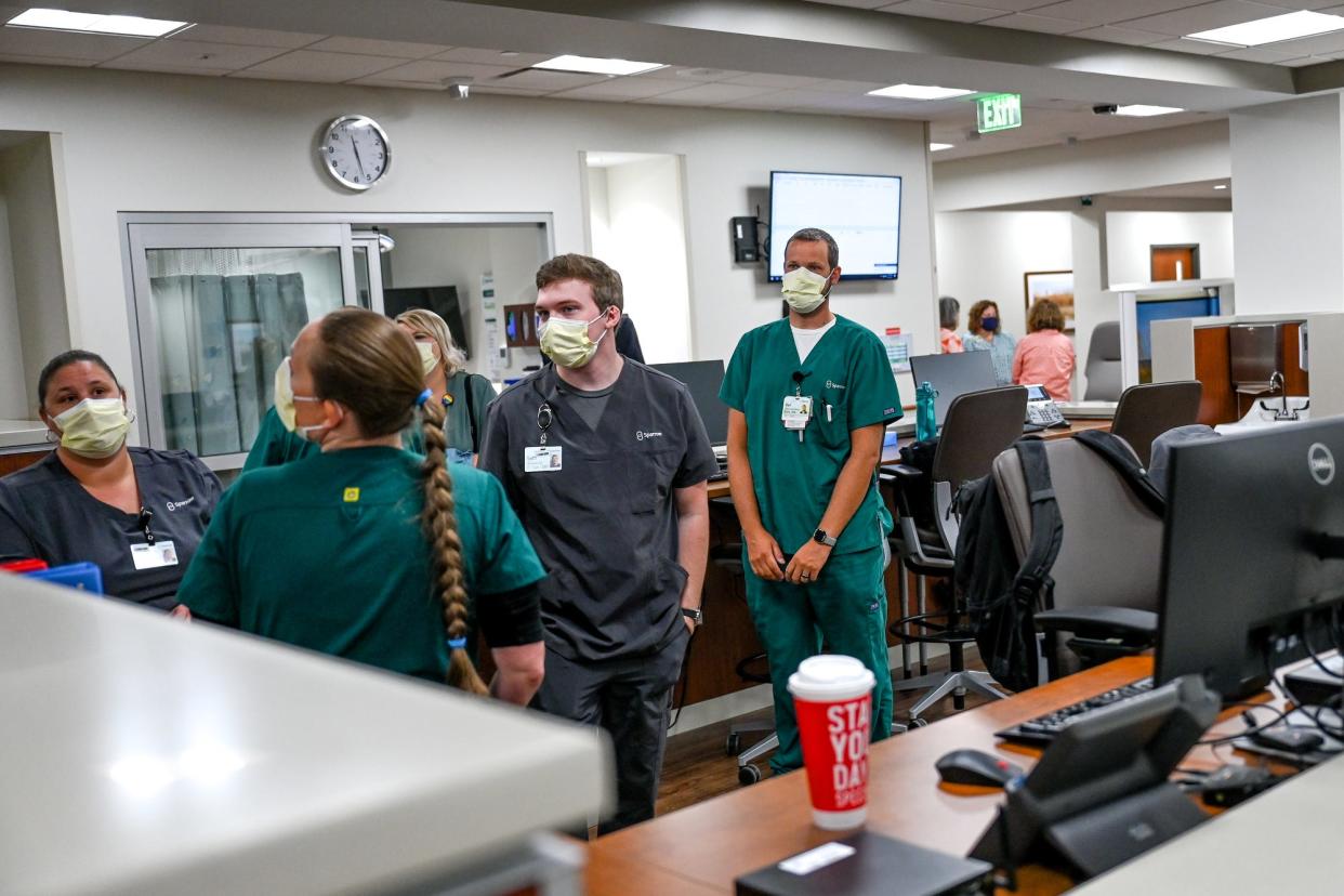 Nursing staff fills the nursing station inside the new Sparrow Emergency Center on Monday, Sept. 12, 2022, in Okemos.