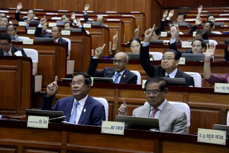 Cambodian Prime Minister Hun Sen (front row) votes during a meeting of the National Assembly in Phnom Penh, on February 20, 2017