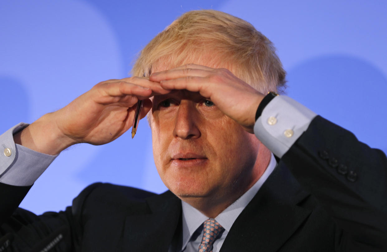 Britain's Conservative Party lawmaker Boris Johnson gestures as he speaks during the official launch of his leadership campaign, in London, Wednesday June 12, 2019. Boris Johnson solidified his front-runner status in the race to become Britain's next prime minister on Tuesday, gaining backing from leading pro-Brexit lawmakers.(AP Photo/Frank Augstein)