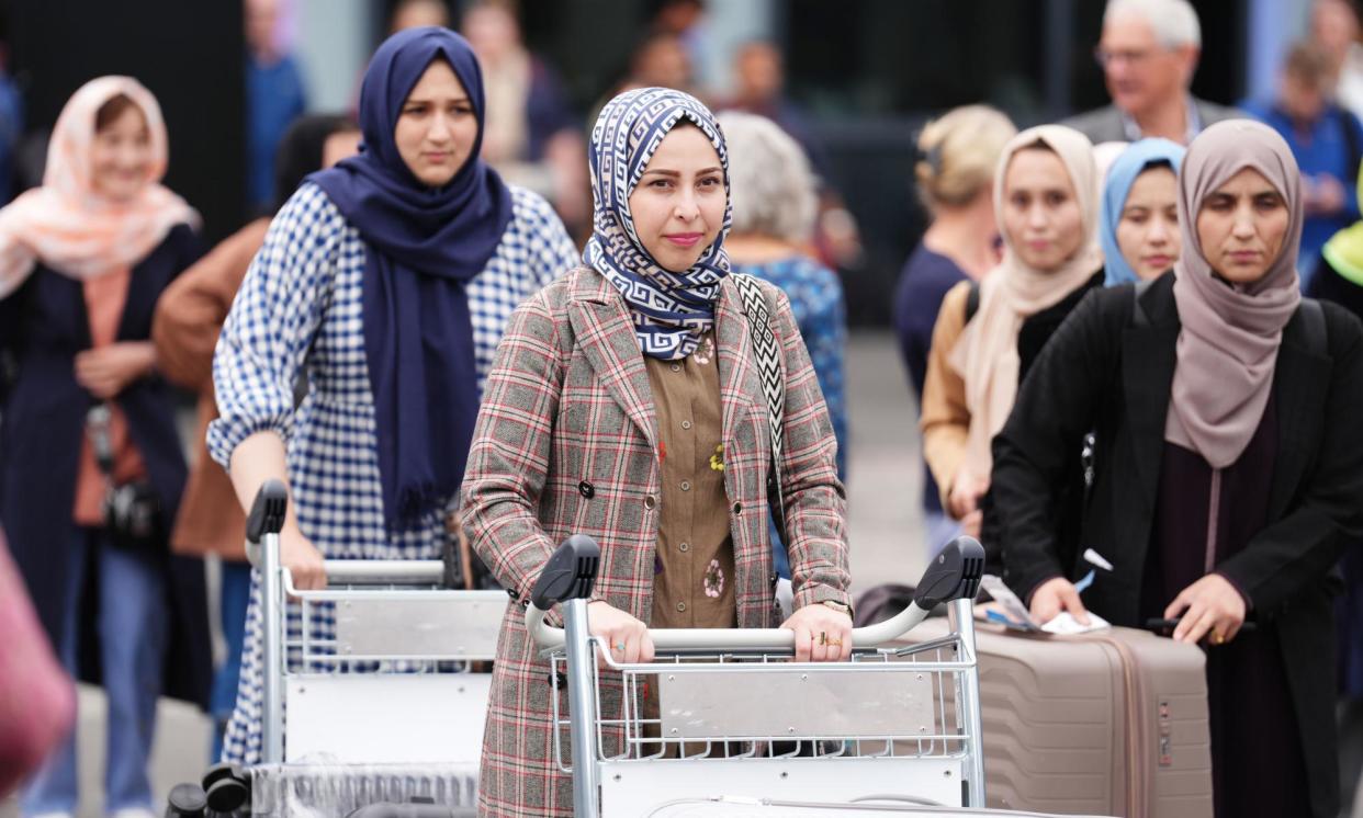 <span>The medical students arriving at Edinburgh airport.</span><span>Photograph: Andrew Milligan/PA</span>