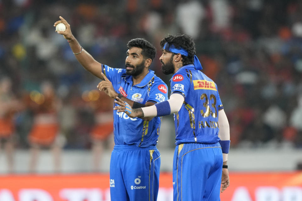 Mumbai Indians' Jasprit Bumrah, left, talks captain Hardik Pandya before bowling a delivery during the Indian Premier League cricket tournament between Sunrisers Hyderabad and Mumbai Indians in Hyderabad, India, Wednesday, March 27, 2024.(AP Photo/Mahesh Kumar A.)