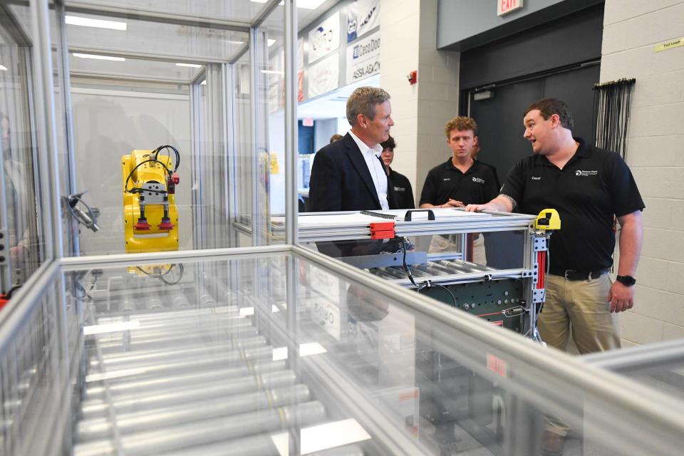 A Jackson State AMT student explains to Gov. Bill Lee the function of a machine as a learning tool during Gov. Bill Lee's tour of Jackson State TCAT facilities in Jackson, Tenn., on Tuesday, Feb.6, 2024.