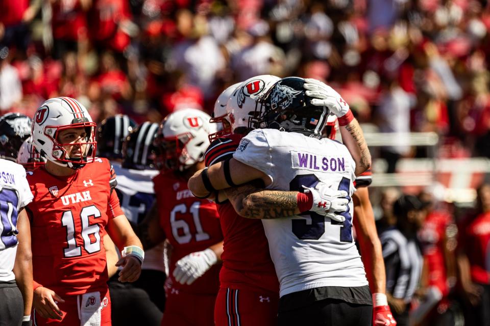 Utah Utes players hug Weber State Wildcats players after their football game at Rice-Eccles Stadium in Salt Lake City on Saturday, Sept. 16, 2023. The Utah Utes won the game with a final score of 31-7. | Megan Nielsen, Deseret News