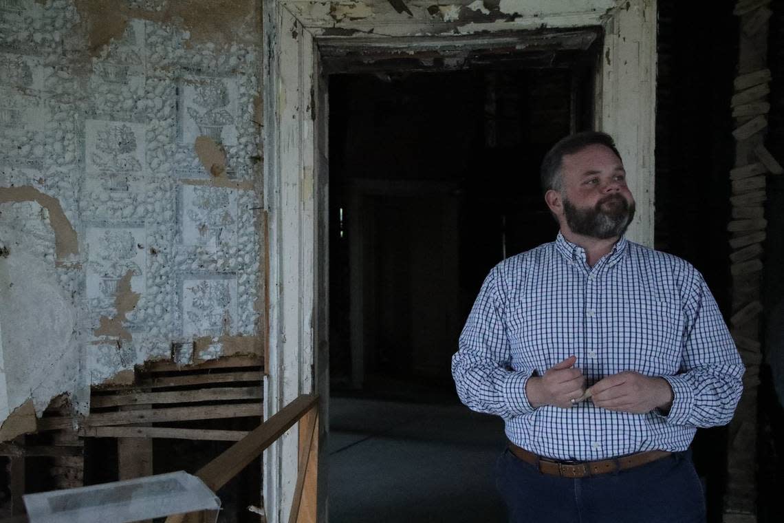 Jonathan Coleman, executive director of the Blue Grass Trust for Historic Preservation shows the interior of the Pope Villa on Grosvenor Avenue.