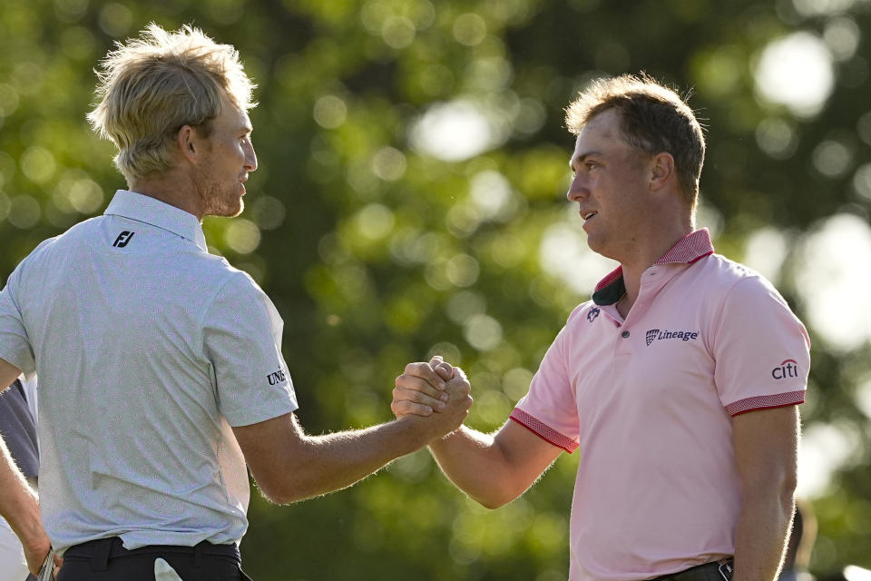 Justin Thomas is greeted by Will Zalatoris after winning the PGA Championship golf tournament in a playoff over Zalatoris at Southern Hills Country Club, Sunday, May 22, 2022, in Tulsa, Okla.(AP Photo/Matt York)