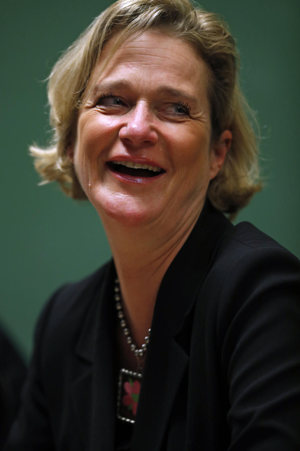 Belgium's artist and sculptor Delphine Boel smiles during a press conference in Brussels, Monday, Oct. 5, 2020. Artist and sculptor Delphine Boel is on the cusp of officially becoming a Belgian princess after a Brussels court on Thursday, Oct. 1, 2020 ruled in her favor in a decades-old royal paternity scandal pitting her against former King Albert II. (AP Photo/Francisco Seco)