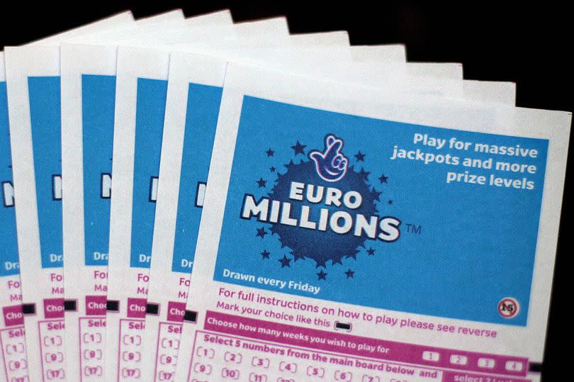 Lottery tickets for the EuroMillions jackpot are displayed in central London