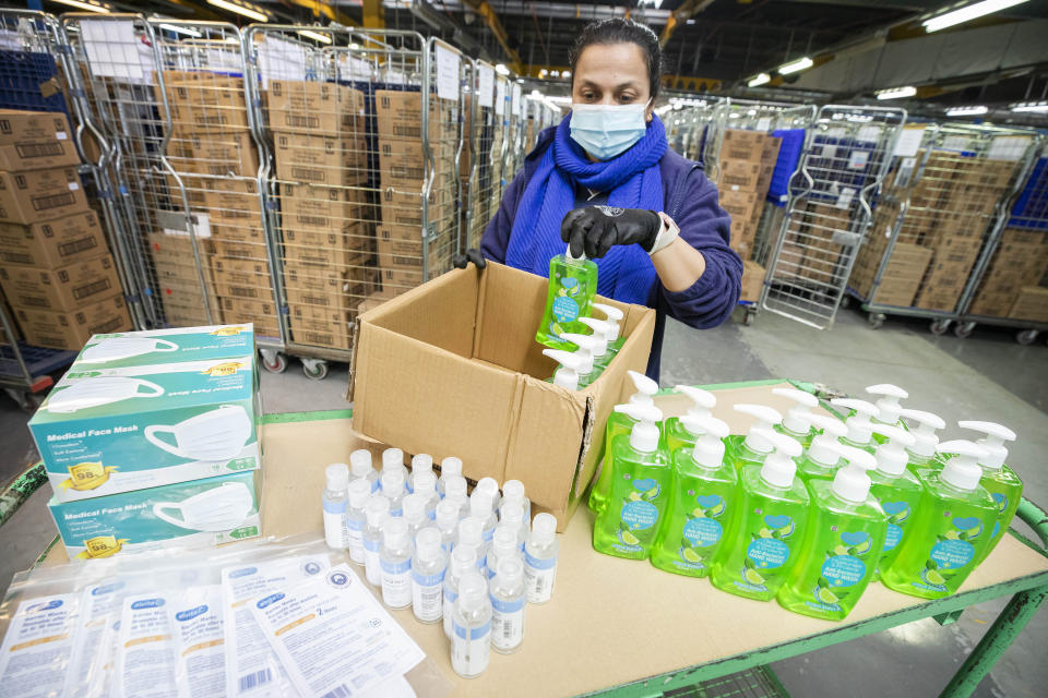 EDITORIAL USE ONLY?? Boots Warehouse Operative Farida Vanat prepares??some of the 84,000 PPE products, including face masks and hand sanitiser??for The Hygiene Bank charity in Nottingham, as the??health and beauty retailer??makes the donation??to help tackle hygiene poverty in the UK.