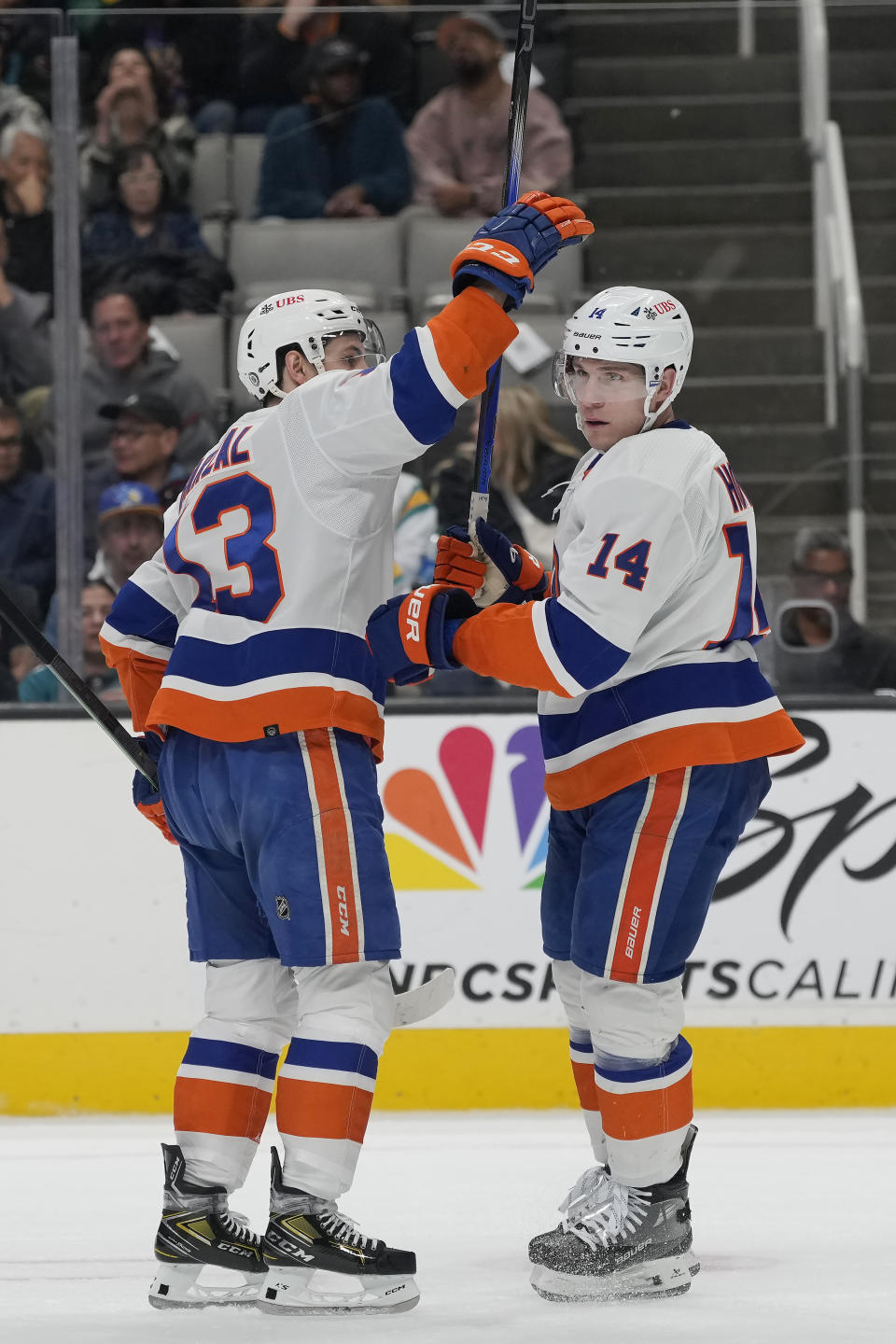 New York Islanders center Bo Horvat, right, is congratulated by center Mathew Barzal after scoring against the San Jose Sharks during the second period of an NHL hockey game in San Jose, Calif., Thursday, March 7, 2024. (AP Photo/Jeff Chiu)