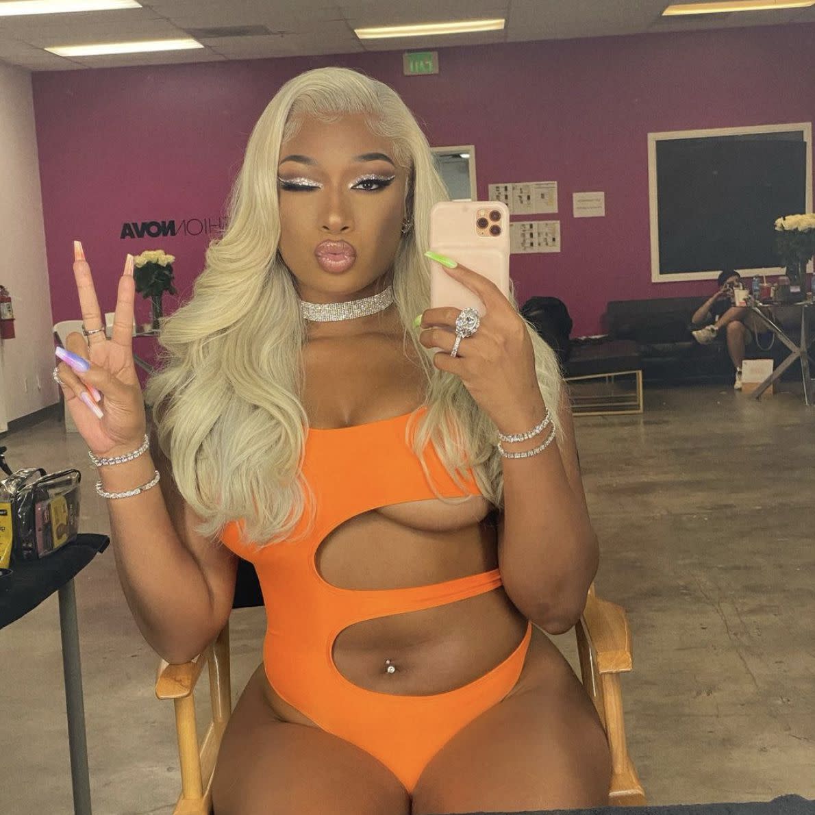 "Savage" rapper teases a new collection from FashionNova with a bright orange one-piece on Tuesday, June 15, 2021. "I’m working new @fashionnova dropping soon"