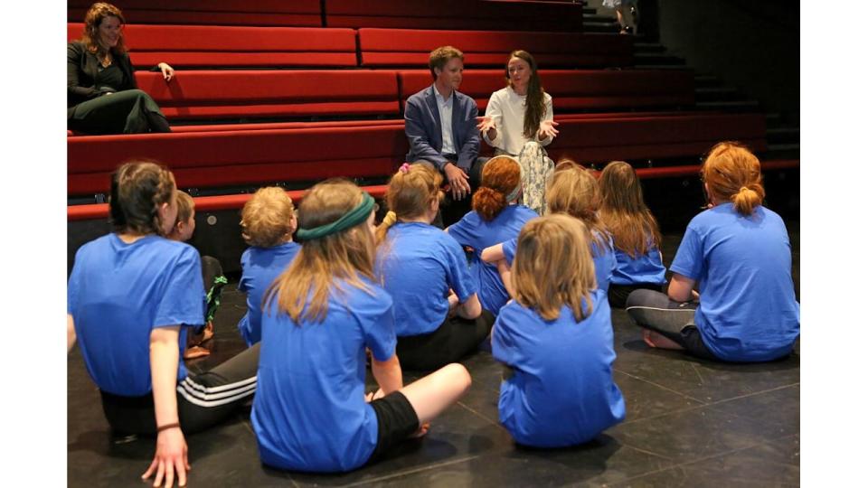 The Duke of Westminster and Olivia Henson speaking to a group of children