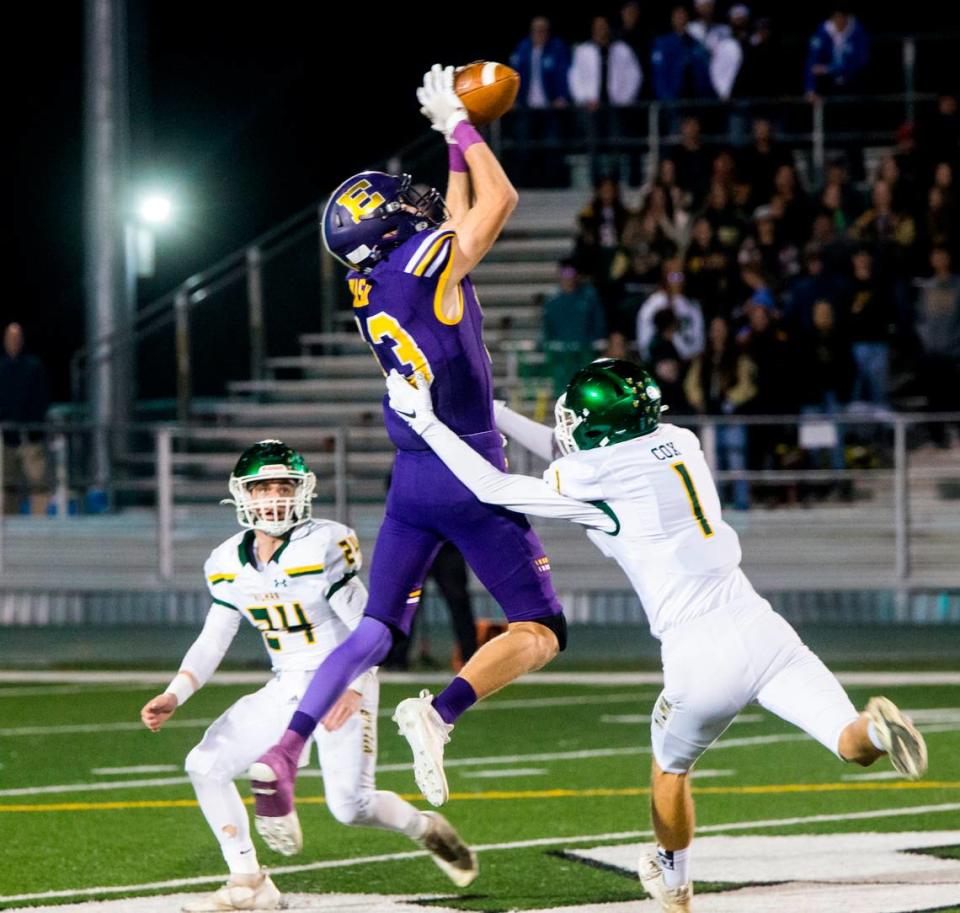 Escalon Highs Owen Nash, 13, jumps for a pass as Hilmar Highs Luke Cox, 1, and Jason Pimentel, 24, move in. Escalon High School took on Hilmar High football during the 2021 CIF Sac-Joaquin Football Playoffs - Division V at Saint Mary’s High School in Stockton, Ca. Escalon came out on top as the champions with a 20-13 win over Hilmar.