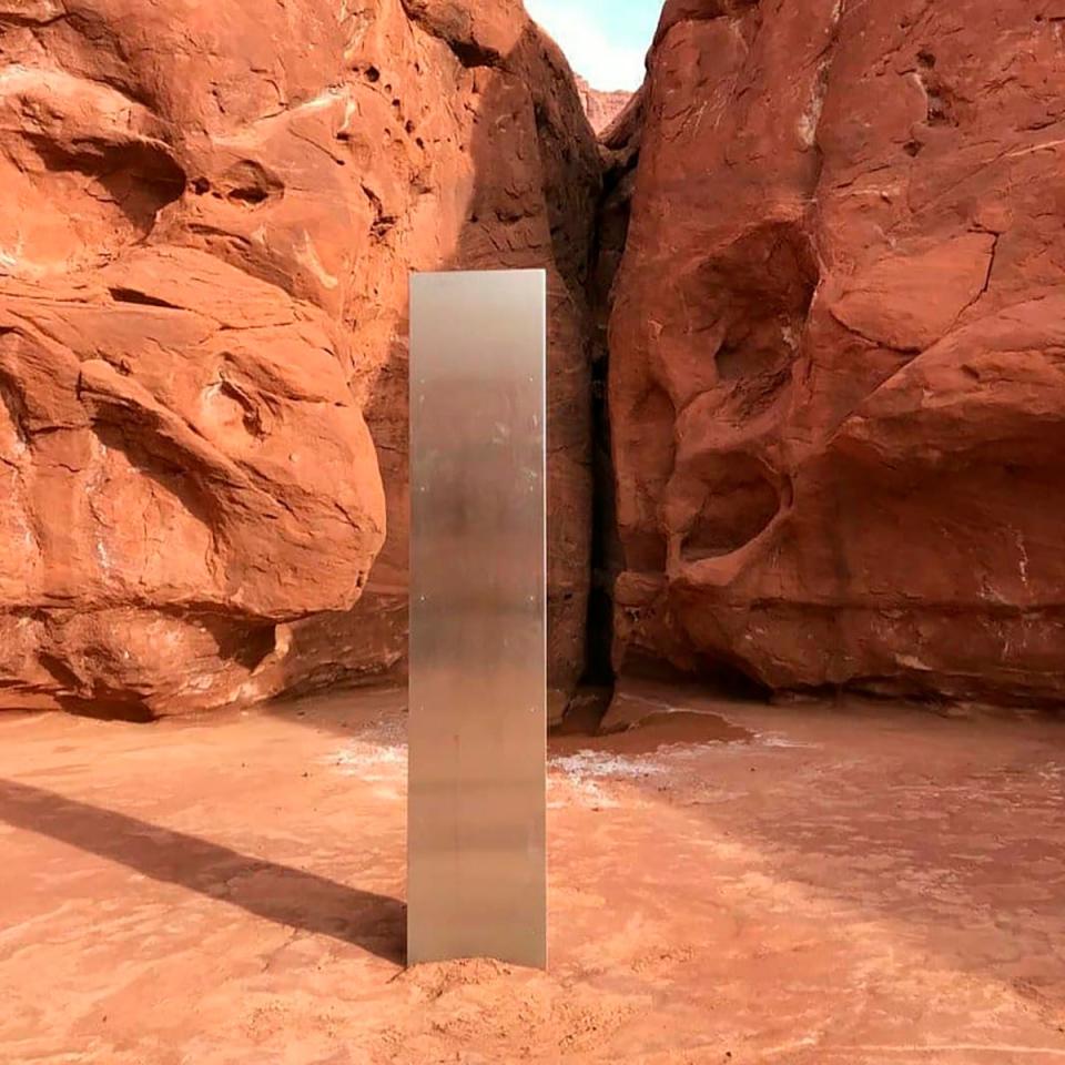 A metal monolith in the ground in a remote area of red rock in Utah. The mysterious silver monolith that was placed in the Utah desert has disappeared less than 10 days after it was spotted by wildlife biologists performing a helicopter survey of bighorn sheep, federal officials and witnesses said (AP)