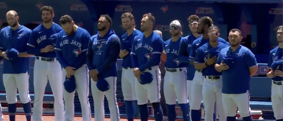 Toronto Blue Jays players during a moment of silence for Julia Budzinski. (Sportsnet)