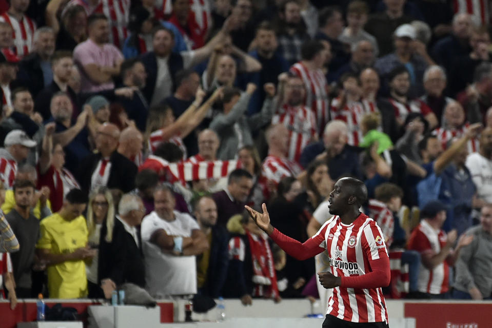 Brentford's Yoane Wissa celebrates after scoring his side's third goal during the English Premier League soccer match between Brentford and Liverpool at the Brentford Community Stadium in London, Saturday, Sept. 25, 2021. (AP Photo/Rui Vieira)