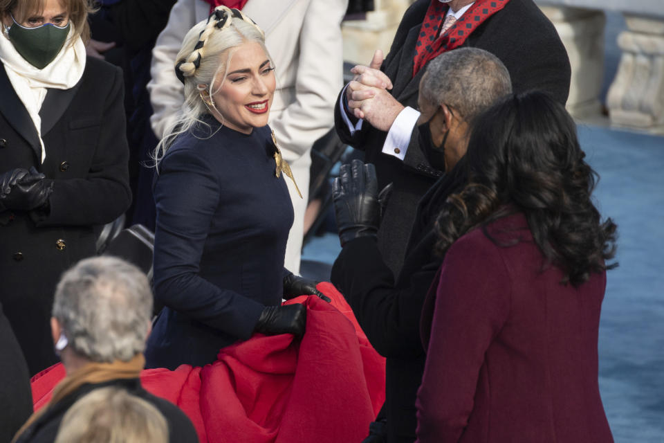 Lady Gaga, center, talks with former President Barack Obama and his wife Michelle before the inauguration ceremonies of Joe Biden as the 46th President on Wednesday, Jan. 20, 2021, at the U.S. Capitol in Washington.  (Saul Loeb/Pool Photo via AP)