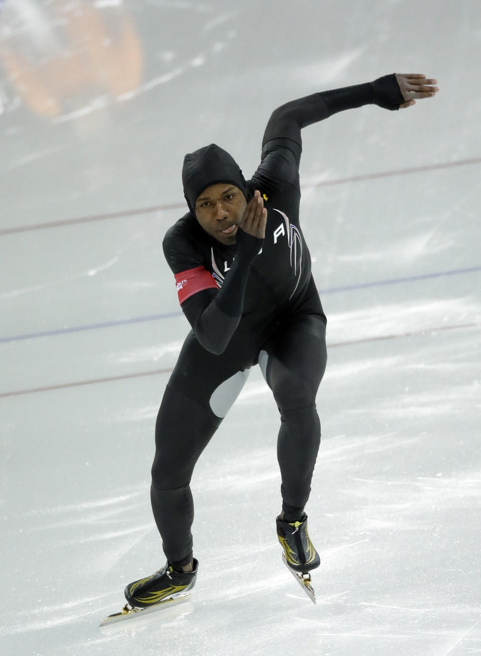 Shani Davis of the U.S. takes the start during the men's 1,000-meter speedskating race at the Adler Arena Skating Center during the 2014 Winter Olympics in Sochi, Russia, Wednesday, Feb. 12, 2014. (AP Photo/David J. Phillip )