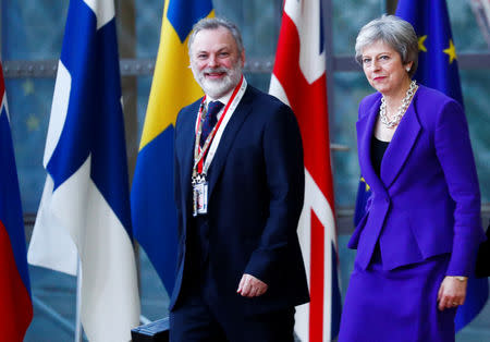 Britain's Prime Minister Theresa May and Britain's Permanent Representative to the EU Tim Barrow arrive for the European Union leaders summit in Brussels, Belgium October 18, 2018. REUTERS/Francois Lenoir