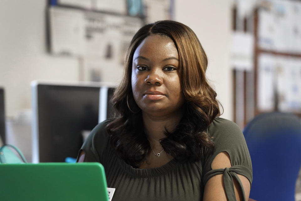 Dana Anthony is seen at her workplace at The Daily Tar Heel newspaper in Chapel Hill, N.C., Tuesday, April 13, 2021. Anthony was rejected after two speparate HireVue interviews for other jobs recently. The pandemic has heightened demand for online services that interview job applicants remotely and use artificial intelligence to assess their skills. But the technology also raises questions about whether computers can accurately judge a person's character traits and emotional cues. (AP Photo/Gerry Broome)