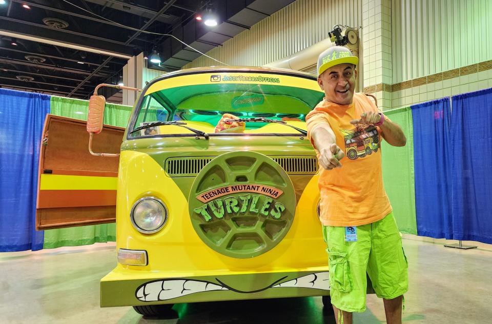 Jason Ybarra stands in front of his custom-made Teenage Mutant Ninja Turtle Van Saturday at AMA-CON at the Amarillo Civic Center.