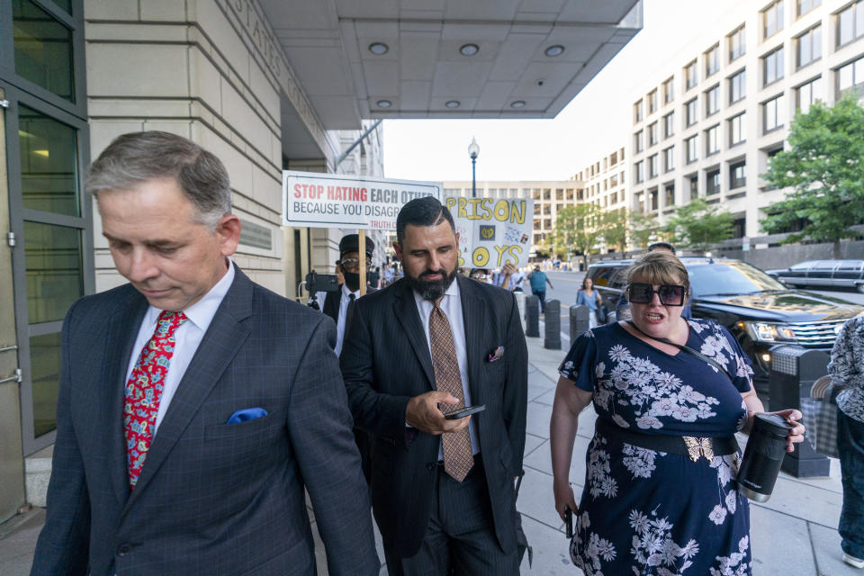 Attorneys for Enrique Tarrio, Sabino Jauregui, left, and Nayib Hassan depart after speaking with reporters outside federal court, Tuesday, Sept. 5, 2023, in Washington. Former Proud Boys leader Enrique Tarrio has been sentenced to 22 years in prison for orchestrating a failed plot to keep Donald Trump in power after the Republican lost the 2020 presidential election. (AP Photo/Alex Brandon)