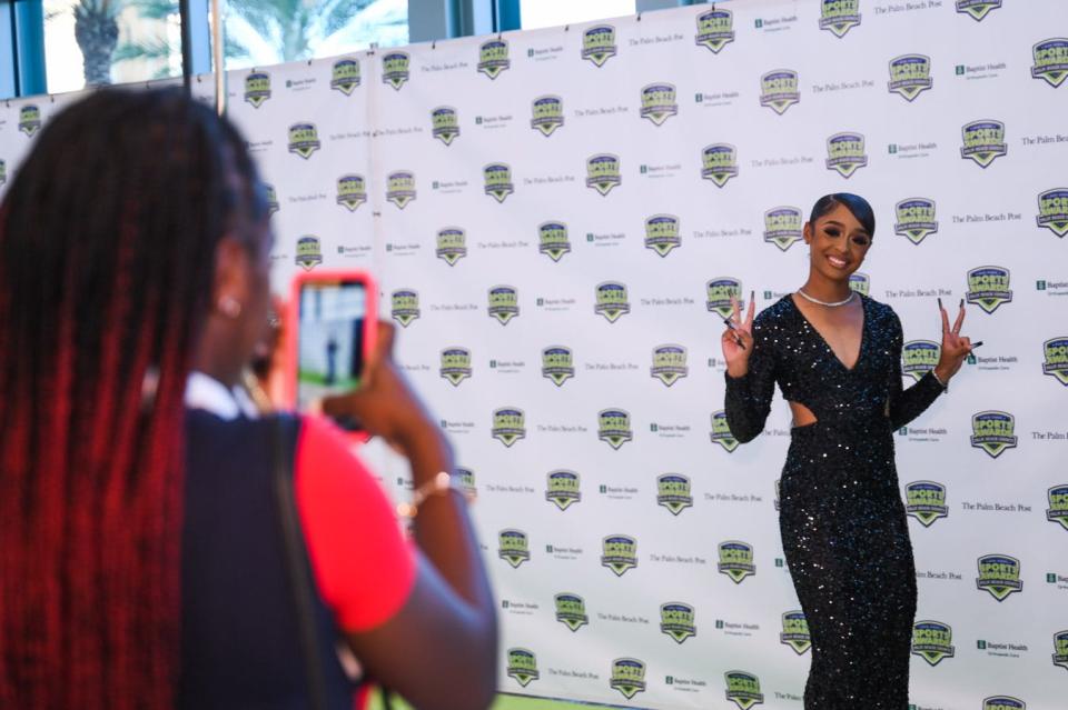 American Heritage-Delray track and field student-athlete Destiny St. Cyr has her picture taken by friend Taiyanna Cage prior to the start of the Palm Beach Post High School Sports Awards ceremony at the Kravis Center in West Palm Beach.