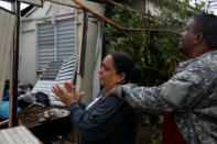 <p>A woman reacts while she looks at the damages in the house of her mother after the area was hit by Hurricane Maria in Guayama, Puerto Rico, Sept. 20, 2017. (Photo: Carlos Garcia Rawlins/Reuters) </p>