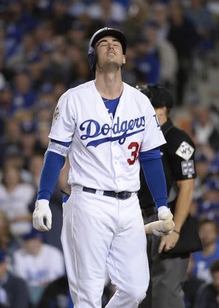 FILE PHOTO: Nov 1, 2017; Los Angeles, CA, USA; Los Angeles Dodgers first baseman Cody Bellinger reacts after striking out against the Houston Astros in the 7th inning in game seven of the 2017 World Series at Dodger Stadium. Gary A. Vasquez-USA TODAY Sports