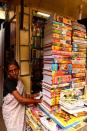 Volumes are stacked up in a College Street book stall.