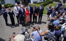 President Joe Biden, with a bipartisan group of Senators, speaks Thursday June 24, 2021, outside the White House in Washington. Biden invited members of the group of 21 Republican and Democratic senators to discuss the infrastructure plan. (AP Photo/Evan Vucci)