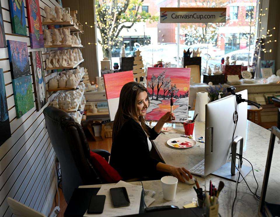 Mahsa Ghavamian, owner of Canvas n Cup, leads an online acrylic painting class from her downtown Westborough shop, Nov. 19, 2021.