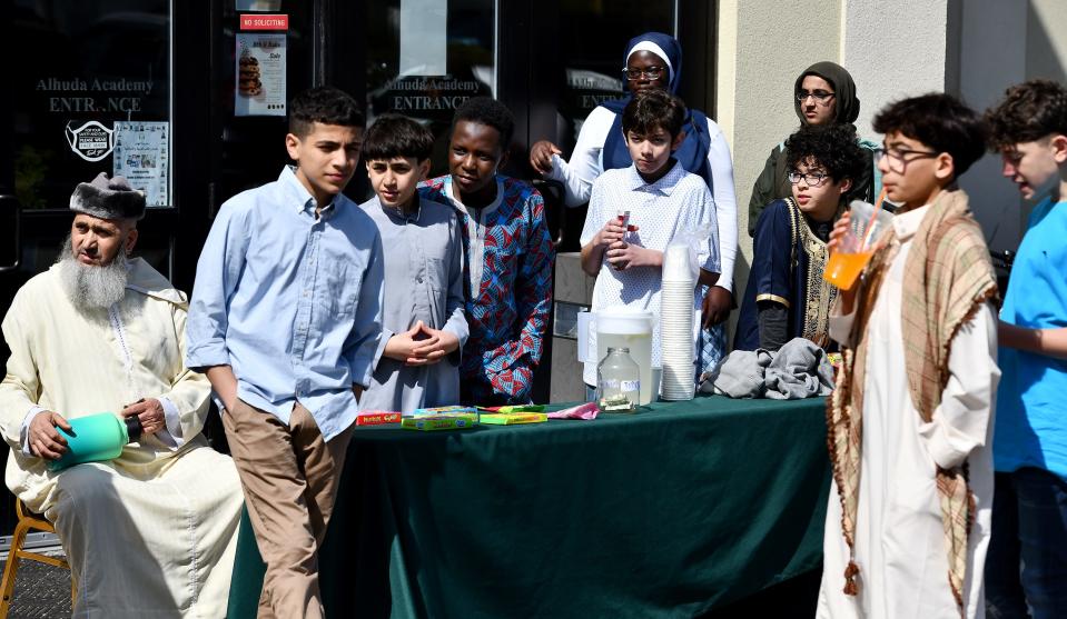 A group of boys run a lemonade and candy stand to raise money for the mosque during the Eid al-Fitr celebration at the Worcester Islamic Center on Friday.