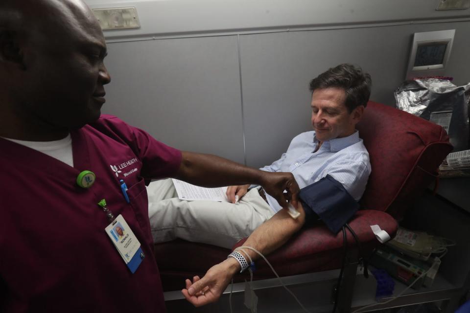 The need for blood donations often spikes after a hurricane. Here shows one station during the coronavirus pandemic at a bloodmobile stationed  stationed at American Red Cross off of Cypress Terrace in Fort Myers on Sunday. Larry Antonucci, the President and CEO of Lee Health also donated along NCH President and CEO Paul Hiltz.