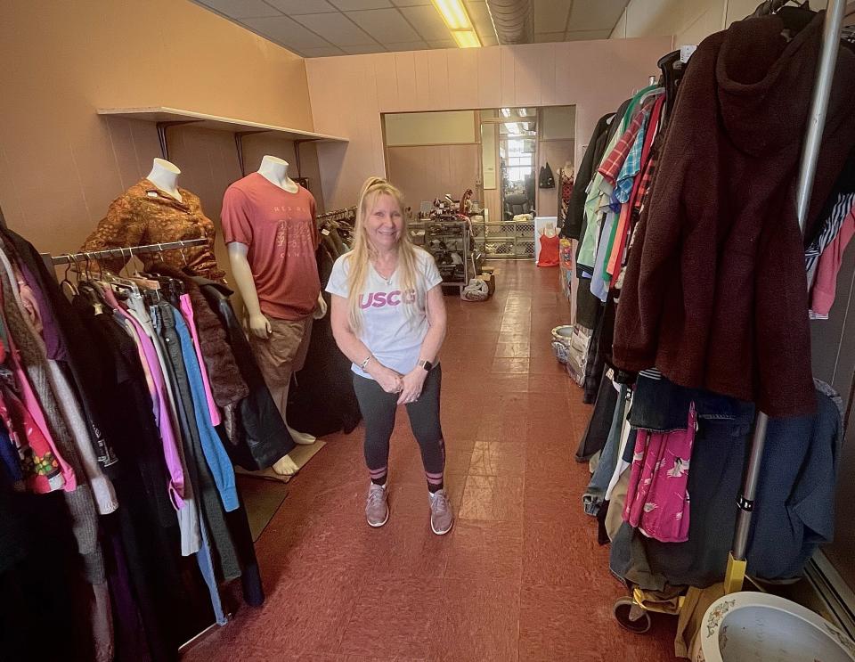 Julia Keene, whose husband Michael is co-owner of Taunton Antiques Center, is seen here in the store's temporary location at 45 School St.