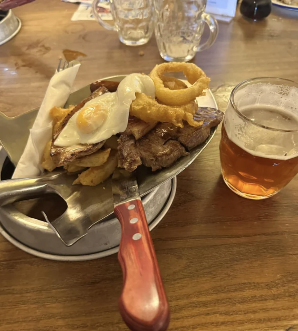 steak served on a shovel at a restaurant