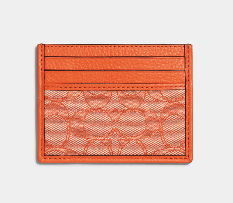 Slim Id Card Case In Signature Jacquard. Image via Coach Outlet.