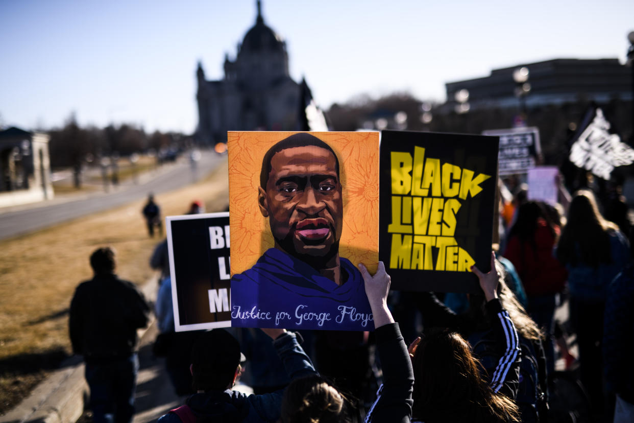 ST PAUL, MN - MARCH 19: People march near the Minnesota State Capitol to honor George Floyd on March 19, 2021 in St Paul, Minnesota. This morning Judge Peter Cahill rejected motions for change of venue and continuance by the defense of former Minneapolis Police officer Derek Chauvin, who is accused of killing George Floyd last May. (Photo by Stephen Maturen/Getty Images)