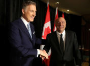 Conservative Party of Canada's leadership candidates Kevin O'Leary and Maxime Bernier shake hands at a news conference in Toronto, Canada April 26, 2017. O'Leary announced his withdrawal from the race and his support for Bernier. REUTERS/Fred Thornhill