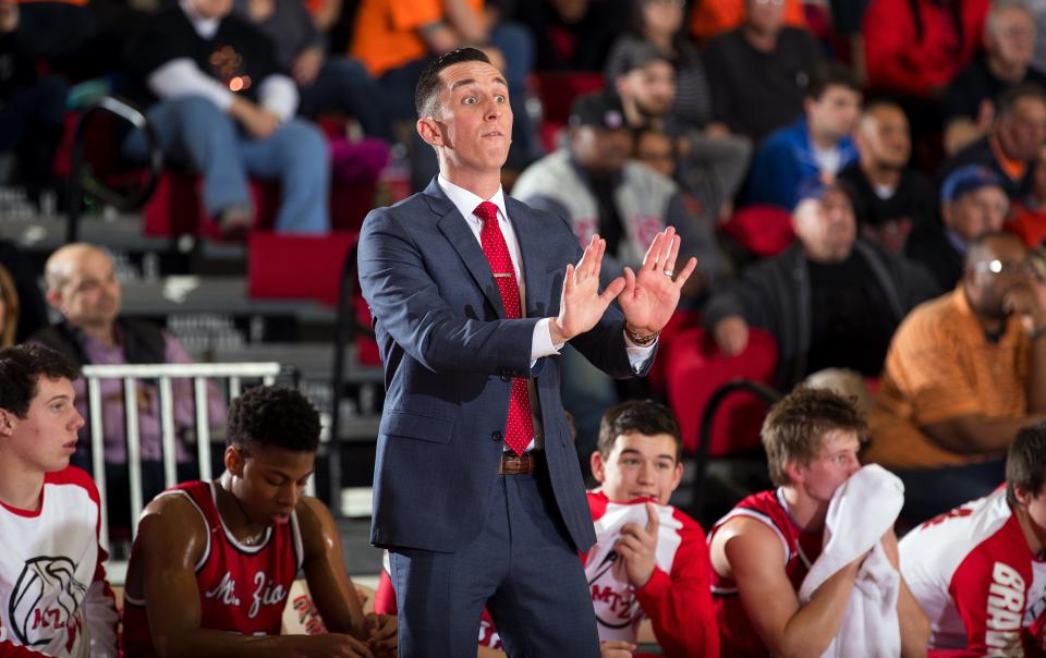 Mount Zion head coach Bryon Graven instructs his team to slow down against Lanphier during the Class 3A Sectional final in Effingham Friday, March 10, 2017. [Ted Schurter/The State Journal-Register]