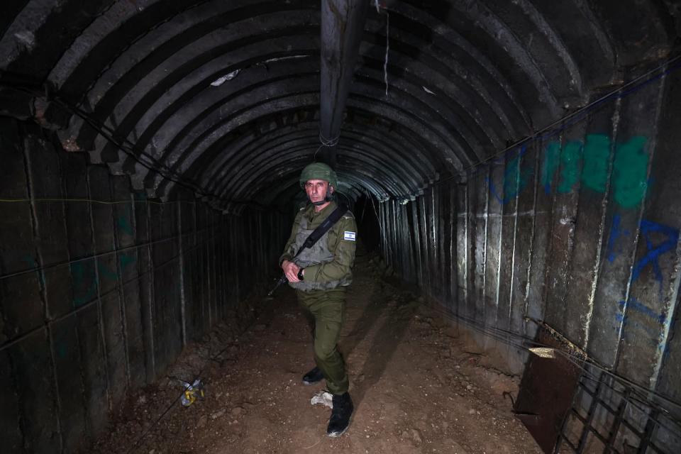 In this picture taken during a media tour organized by the Israeli military on Dec. 15, army spokesperson Daniel Hagari stands in a tunnel that Hamas reportedly used to attack Israel through the Erez border crossing on Oct. 7.