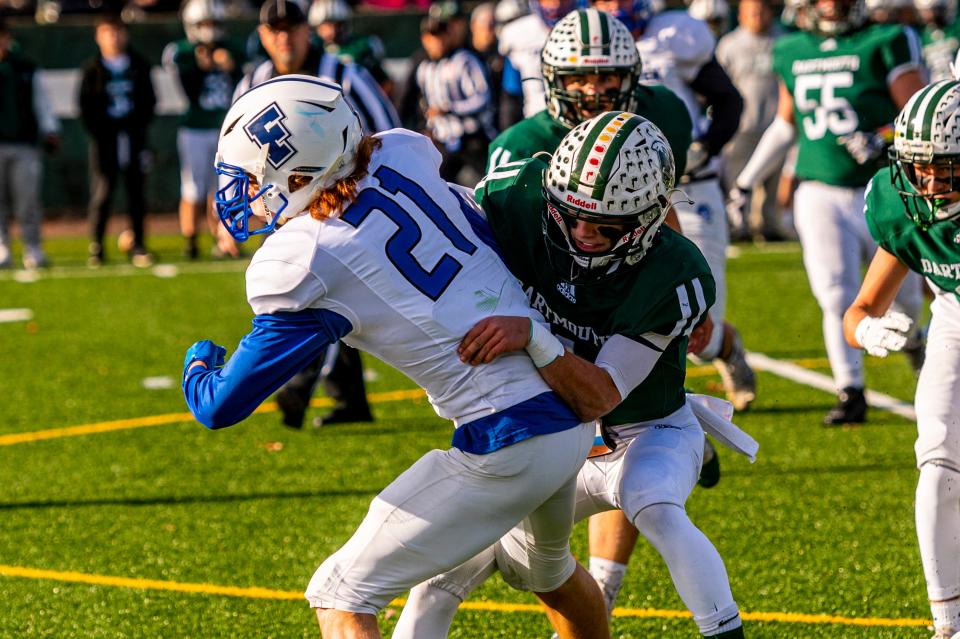 Dartmouth's Will Kelly tackles Fairhaven's Colby Correia on Thanksgiving.